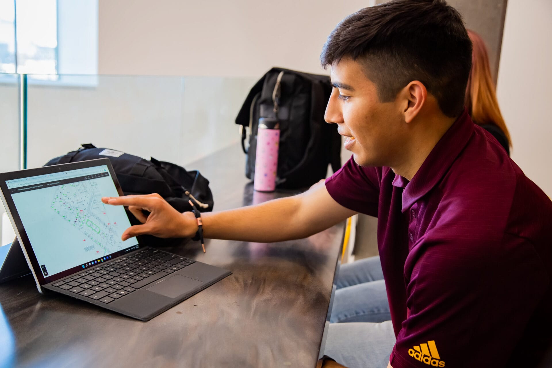 College of Global Futures student in Walton Center for Planetary Health engaging with computer