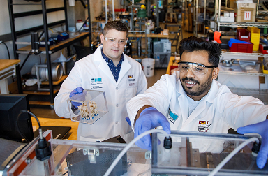 Student and researcher working together in an ASU Center for Negative Carbon Emissions lab