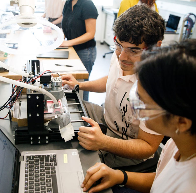 Students working on building a computer